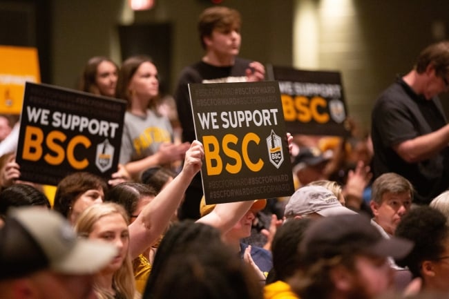 Birmingham-Southern supporters holding signs